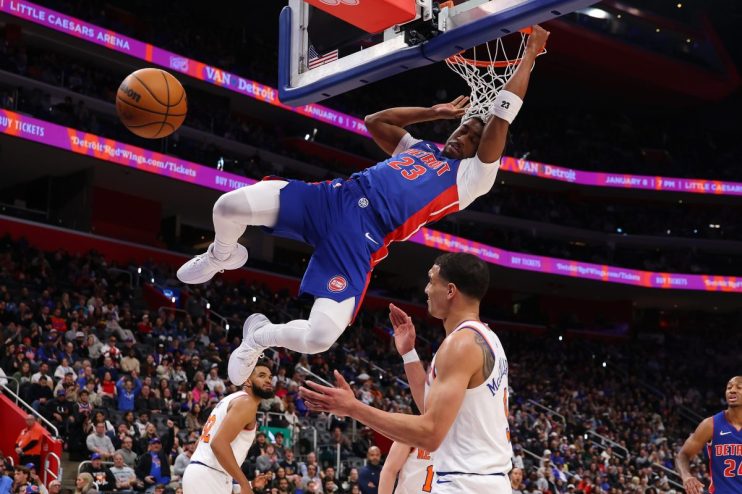 Getty Images logo on a digital screen with abstract financial charts and data, representing modern business trends and ins...