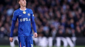 Business professionals in a meeting discussing strategic planning at a conference table, emphasizing teamwork and collabor...