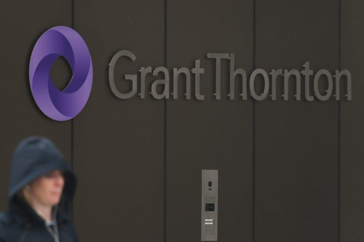 Grant Thornton logo prominently displayed on a modern office building facade, symbolizing global business advisory services.