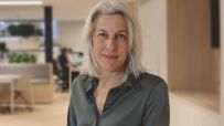 Helen Dickinson in a professional setting discussing business trends and strategies for economic growth on a news website