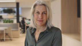 Helen Dickinson in a professional setting discussing business trends and strategies for economic growth on a news website