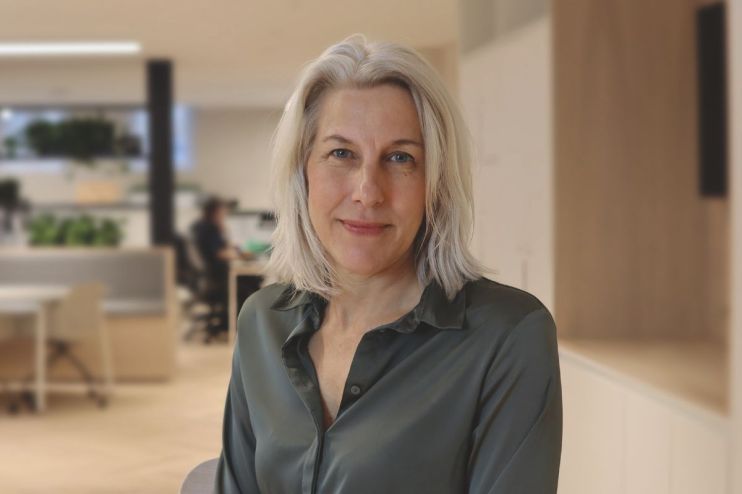 Helen Dickinson in a professional setting discussing business trends and strategies for economic growth on a news website