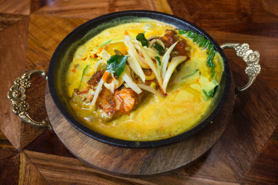 Hoppers Shoreditch restaurant exterior with vibrant signage and bustling street atmosphere in a popular London district