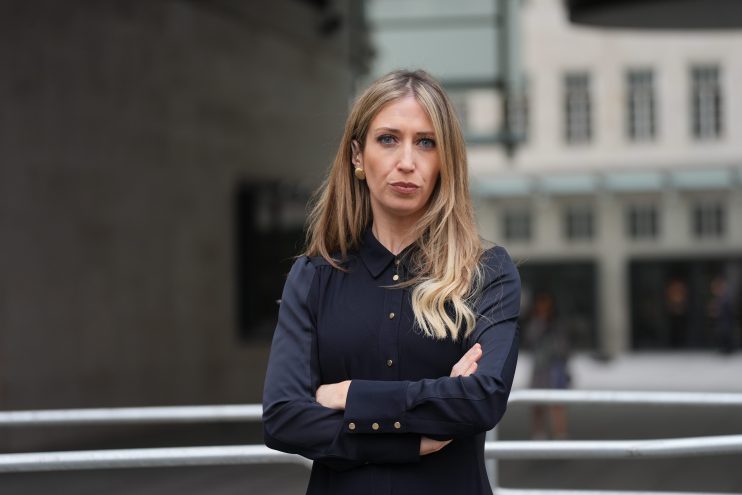 Laura Trott smiling during a public appearance, wearing a professional outfit, reflecting her role in UK politics.