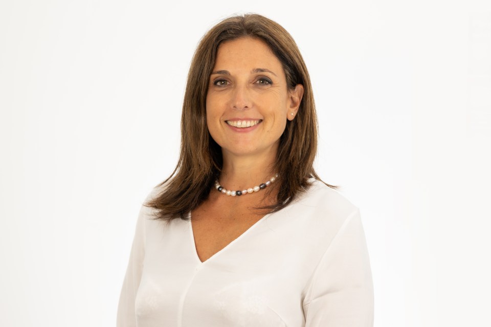 Milena Mondini de Focatiis, CEO, smiling confidently in a business setting, highlighting leadership in the corporate world