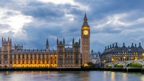Westminster Parliament building under a clear sky, showcasing its iconic architecture in a news context.