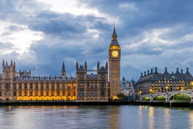 Westminster Parliament building under a clear sky, showcasing its iconic architecture in a news context.