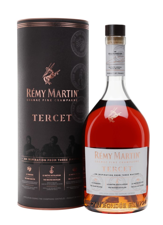 Remy Martin Tercet bottle displayed on a wooden table, highlighting its label and distinctive amber hue in a well-lit setting
