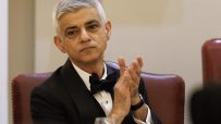 Sadiq Khan speaking at a public event, addressing current issues and engaging with an audience in a formal setting