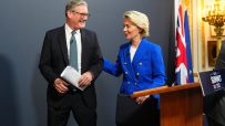 Keir Starmer and Ursula von der Leyen in discussion at a political summit meeting, emphasizing UK-EU relations.