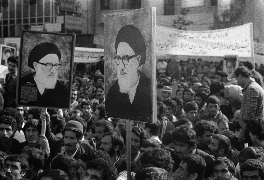 A crowd of people holding placards with the image of Ayatollah Ayat Allah Mahmoud Talkani during the American Embassy siege, Tehran, Iran, November 30th 1979. (Photo by Central Press/Hulton Archive/Getty Images)