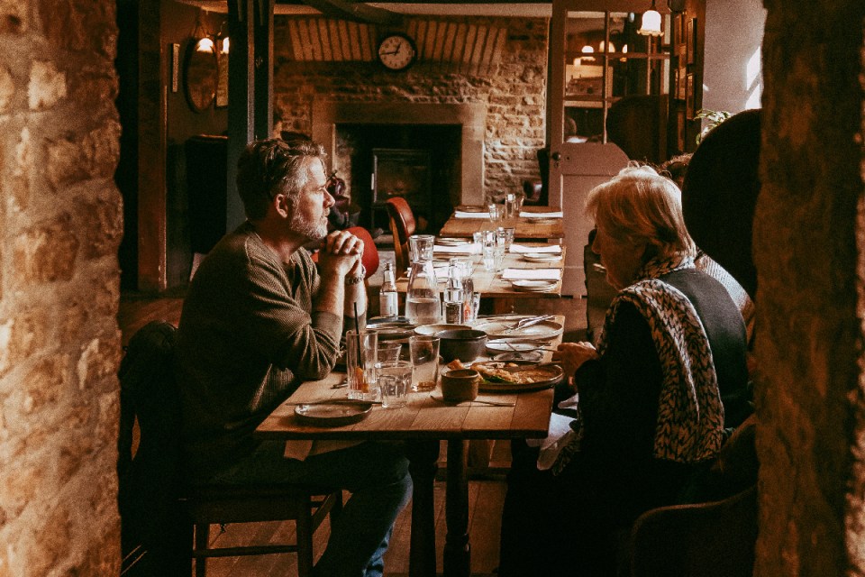 Killingworth Castle interior showcasing elegant wooden decor, cozy seating, and ambient lighting in a historic setting