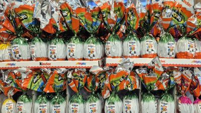 Business meeting with diverse professionals discussing strategy at a modern office table, emphasizing collaboration and in...