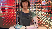 Ai-Da, the humanoid artist robot, showcasing artwork at a gallery exhibition, highlighting AIs creative potential