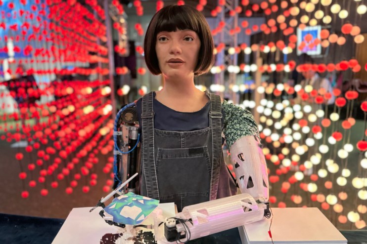Ai-Da, the humanoid artist robot, showcasing artwork at a gallery exhibition, highlighting AIs creative potential