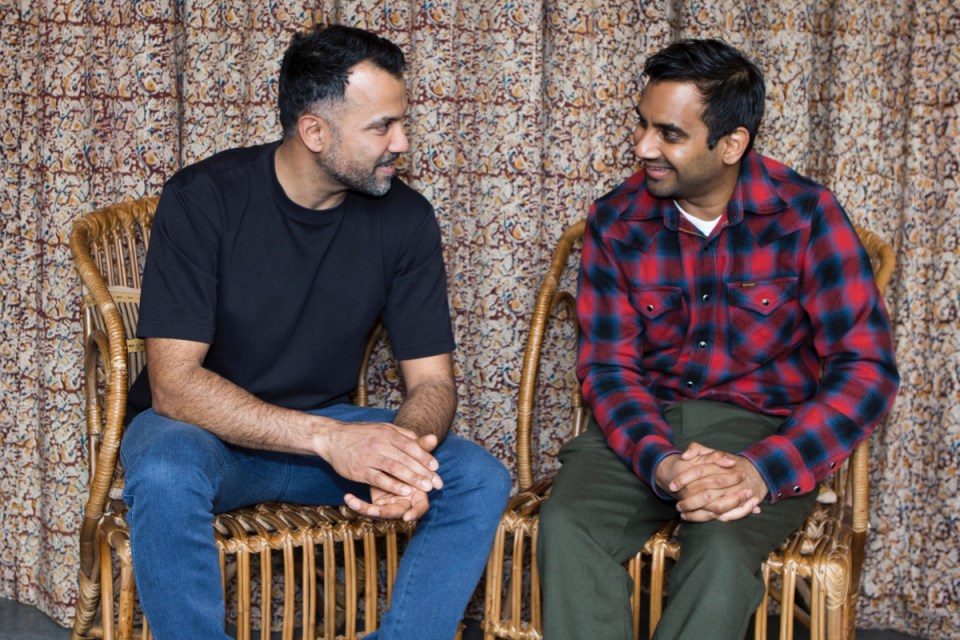 Aziz Ansari and Karan Gokani engage in conversation at a business event, highlighting their collaboration in the culinary ...