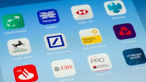 Mobile banking apps interface with charts and notifications on a smartphone, highlighting digital financial management trends