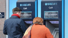 Barclays ATM machine exterior with bank branding and customer interface in a busy urban setting