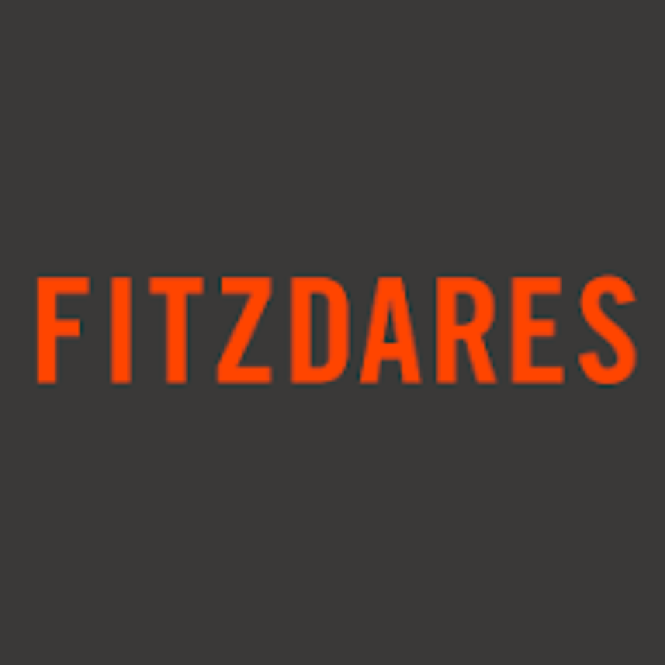 Fitzdares branding on a digital billboard in a bustling city center, highlighting its prominence in the betting industry.