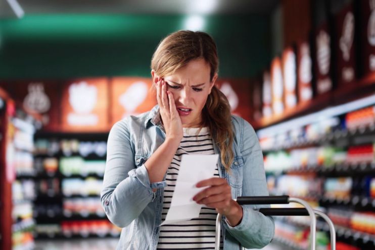 Fresh produce and grocery items in a supermarket aisle highlighting the impact of rising food inflation on consumer prices.