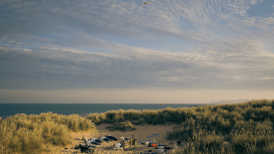 Breaking news update with presenter at desk, digital news graphics, and live broadcast ticker visible in the background