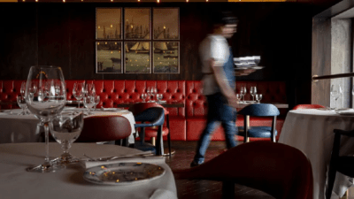 Breaking news headline image with a diverse group of professionals engaged in a business meeting discussing current events