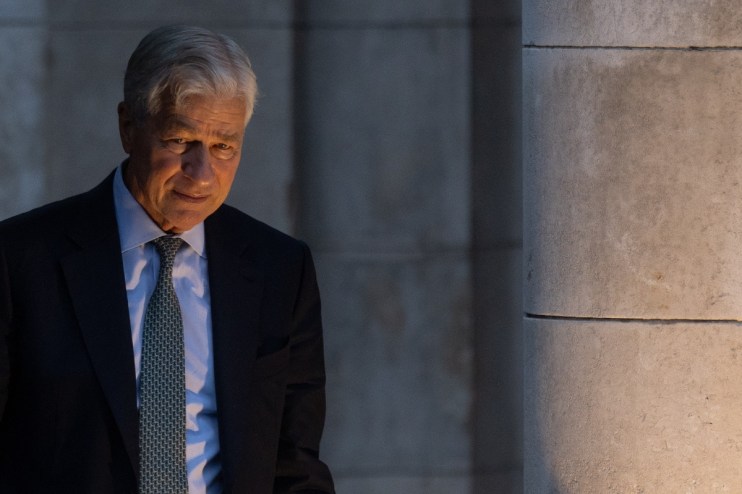Jamie Dimon in a dark suit, serious expression, business setting, highlighting leadership in the financial industry