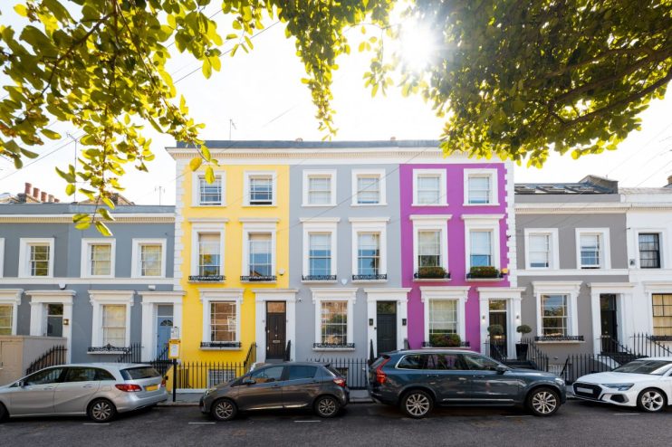 Kensington neighborhood street scene with historic architecture and bustling urban life