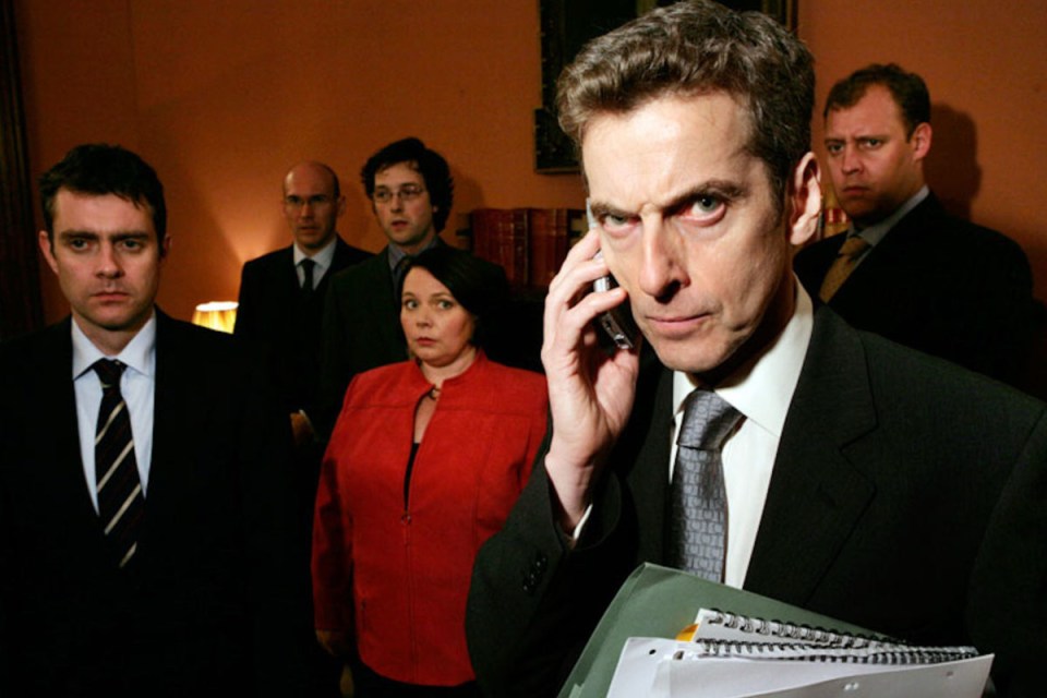 Peter Capaldi as Malcolm Tucker in The Thick of It, wearing a suit and gesturing passionately during a heated discussion.