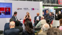 Dougal Shaw, Steph Hind, Gurinder Dhillon, and John Stapleton speaking on stage at SCALE 2 business event