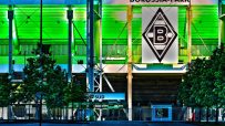 Borussia Park stadium exterior under cloudy sky, home to Bundesligas Borussia M&ouml;nchengladbach, showcasing modern architec...