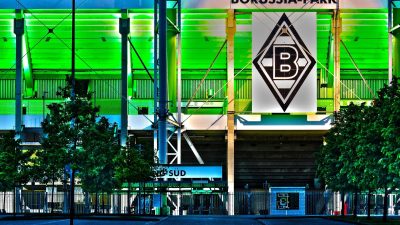 Borussia Park stadium exterior under cloudy sky, home to Bundesligas Borussia M&ouml;nchengladbach, showcasing modern architec...