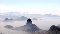 Aerial view of Brazils vibrant cityscape with iconic landmarks and lush greenery under a clear blue sky