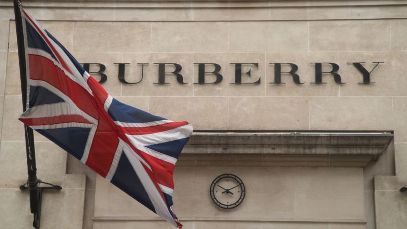 Burberry store showcasing elegant autumn collection with signature trench coats displayed in a chic retail environment
