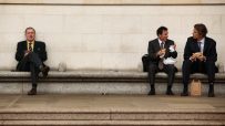Businessman eating lunch outdoors in City of London financial district