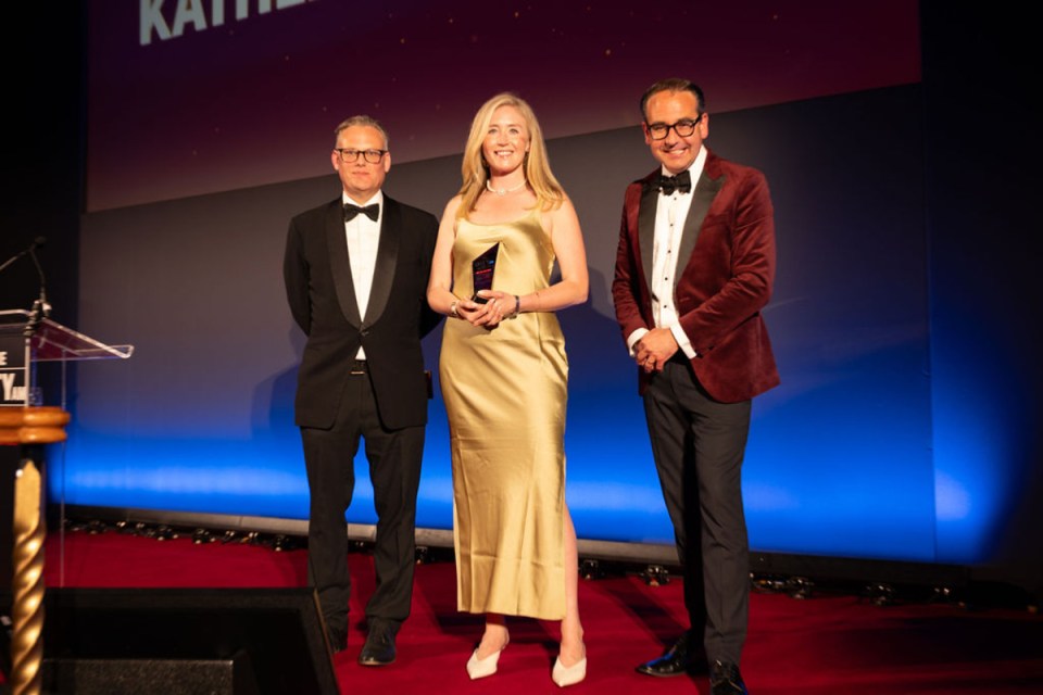 Kathleen Brooks accepting an award at City AM Awards ceremony, celebrating achievements in the business sector.