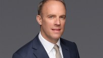 Dominic Raab headshot featuring a professional demeanor, wearing a suit and tie, against a neutral background.