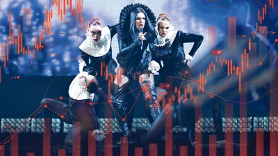 Eurovision hosts on stage with vibrant lighting and audience captured live for online streaming event coverage