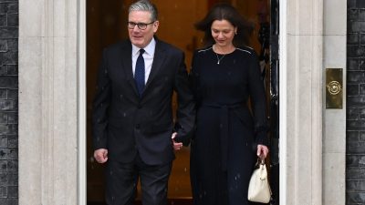 Keir Starmer stands outside 10 Downing Street amid calls for resignation, looking serious and contemplative