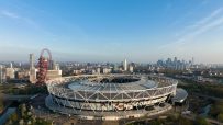 London stadium exterior showcasing modern architecture and vibrant atmosphere during a major event or sports match.
