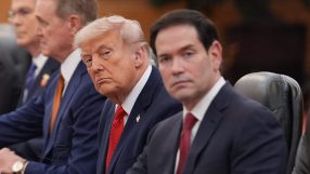 Marco Rubio and Donald Trump engaged in conversation at a political event, highlighting their policy discussions and inter...