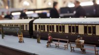 Detailed model railway set showcasing intricate train tracks and miniature landscapes for hobby enthusiasts.