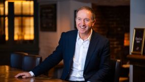 Nick Mackenzie, CEO of Greene King, in a corporate setting discussing company strategy and market trends.