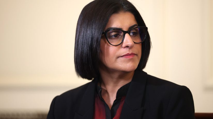 Shabana Mahmood discussing net migration trends, highlighting recent decrease in figures at a press conference.