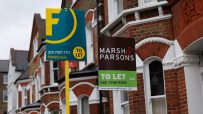 UK cityscape with To Let signs on residential buildings, highlighting the competitive nature of the rental market in 2023.