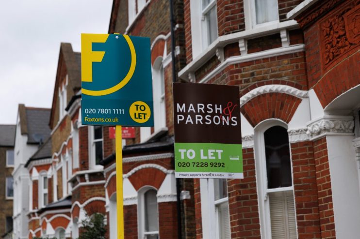 UK cityscape with To Let signs on residential buildings, highlighting the competitive nature of the rental market in 2023.