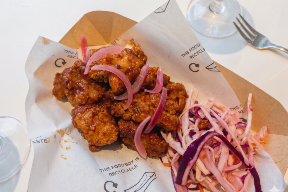 Wimbledon-themed strawberry fried chicken dish elegantly presented on a plate, showcasing a unique culinary fusion.