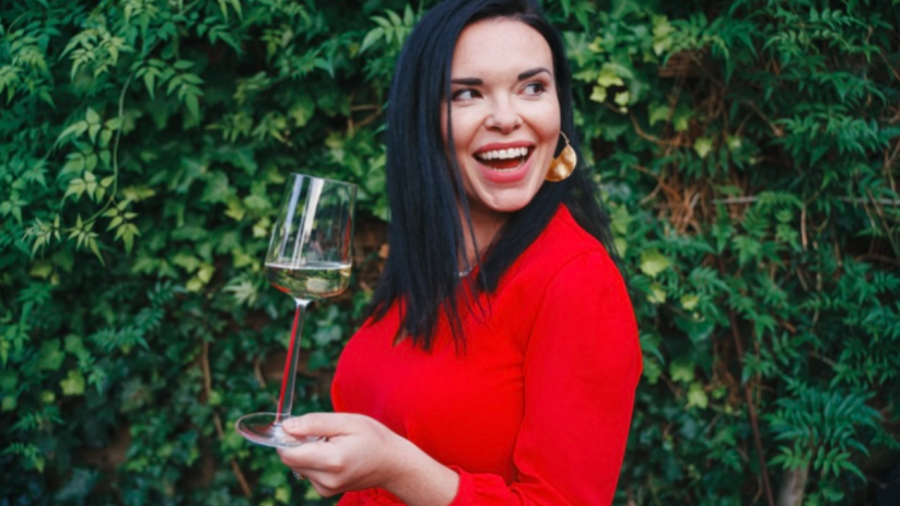 Wine and music enthusiasts enjoying a vibrant London event, featuring wine tasting and live performances in a lively setting.