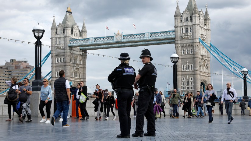 City of London Police officers patrolling streets in uniform, showcasing urban security and law enforcement presence
