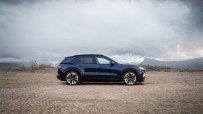 Porsche Cayenne SUV parked on urban street showcasing sleek design and luxury automotive features